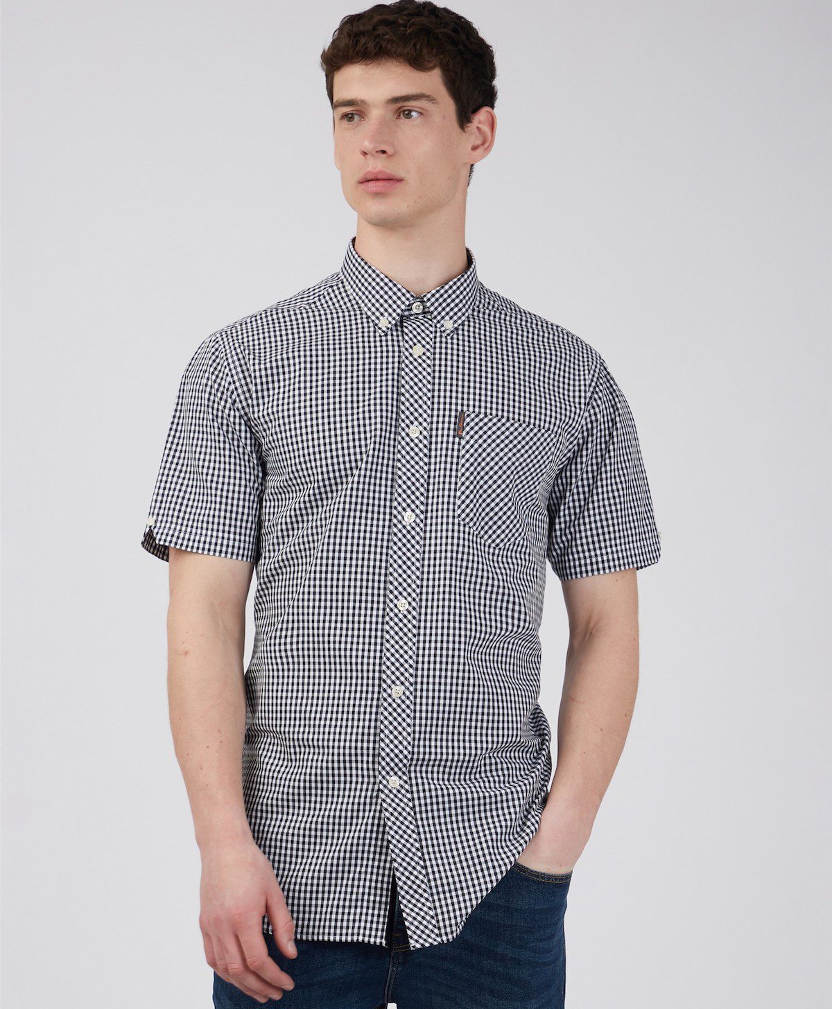 A black and white gingham shirt on a model