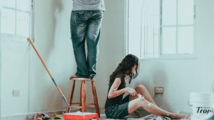 An image of two people renovating their bathroom.
