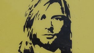 Image shows a portrait of Nirvana singer Kurt Cobain
