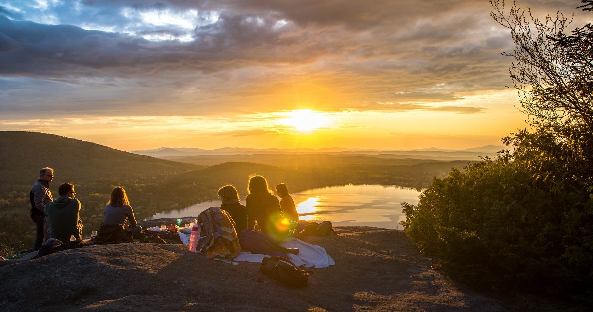 A group of people socialising in nature - www.silvermagazine.co.uk
