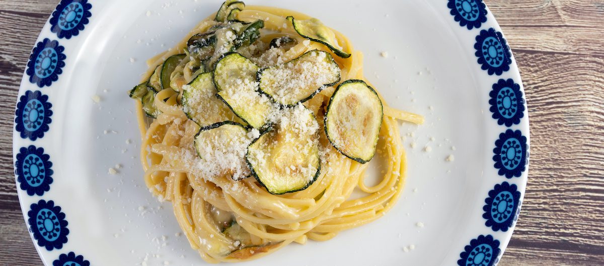 Viral courgette pasta in blue and white bowl. Courgette recipe article. Silver Magazine www.silvermagazine.co.uk