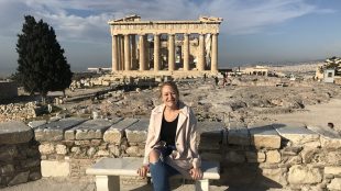 Woman sitting on bench in front of the Parthenon at a very quiet day on the Acropolis. Springtime. Best time to visit Athens review Silver Magazine www.silvermagazine.co.uk