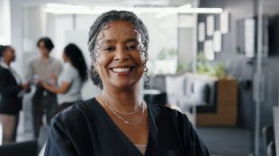 Portrait, business and woman with smile in office for career pride, about us and real estate agent. Mature person, happy realtor and ambition of property development, auction experience and expansion. Change career in 2026 Silver Magazine www.silvermagazine.co.uk