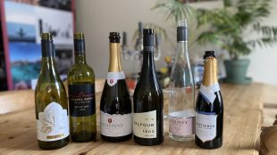 empty English wine bottles on the table. English wine tasting article - Silver Magazine www.silvemagazine.co.uk