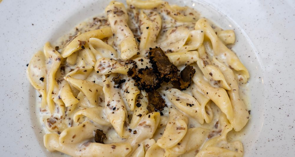 fuzi istrian pasta with black truffle tartufo mashroom and cream traditional food in Rovinj Croatia .