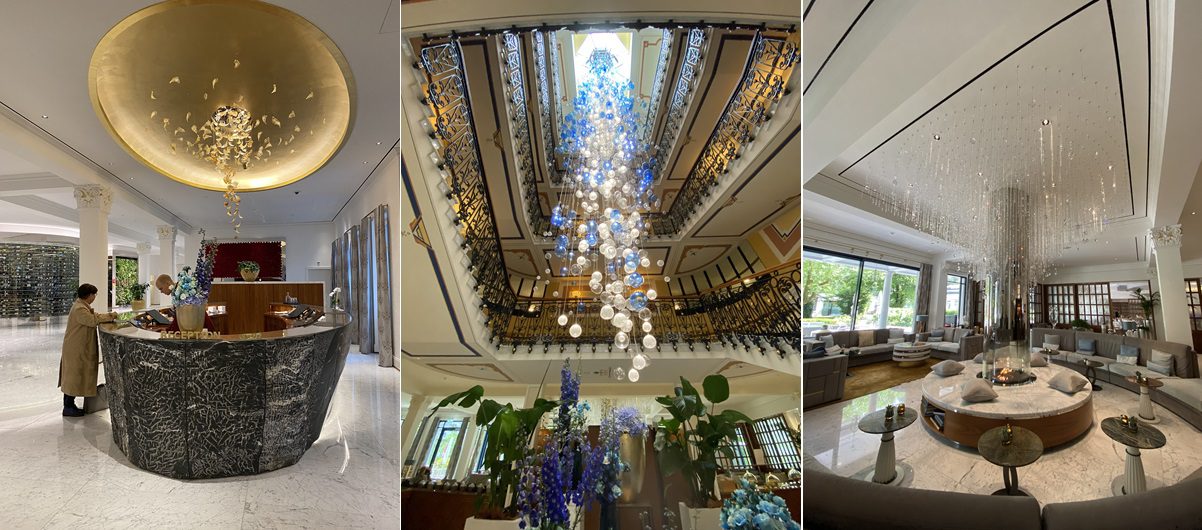 Three images showing the reception desk, the installation of bubble art in the grand staircase stairwell, and the lobby bar with its giant chandelier