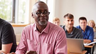 Mature Student Using Digital Tablet In Adult Education Class. Tips for mature student Silver Magazine www.silvermagazine.co.uk