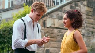 Screen shot still from TV show One Day shows Dexter taking down Emma's phone number on a piece of paper